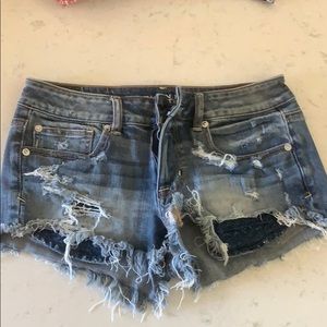 Ripped blue jean shorts